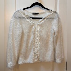 Soft and fuzzy white sweater